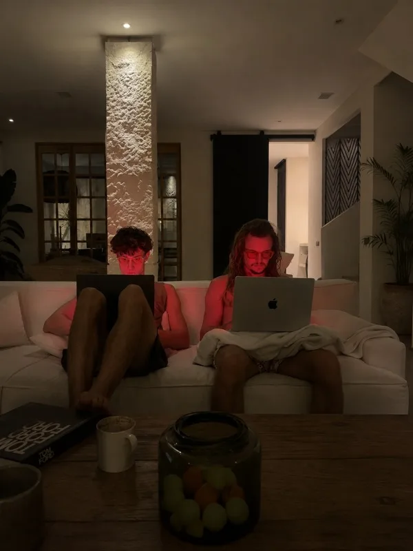 Person relaxing on couch with Sundown blue light filter active
